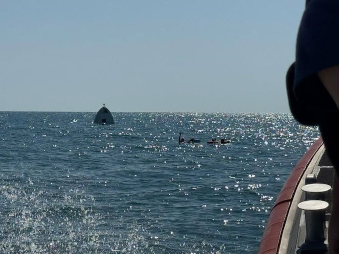 A Coast Guard Station St. Petersburg boat crew rescued three boaters, Friday, after their 29-foot boat capsized approximately six miles west of Bunces Pass.