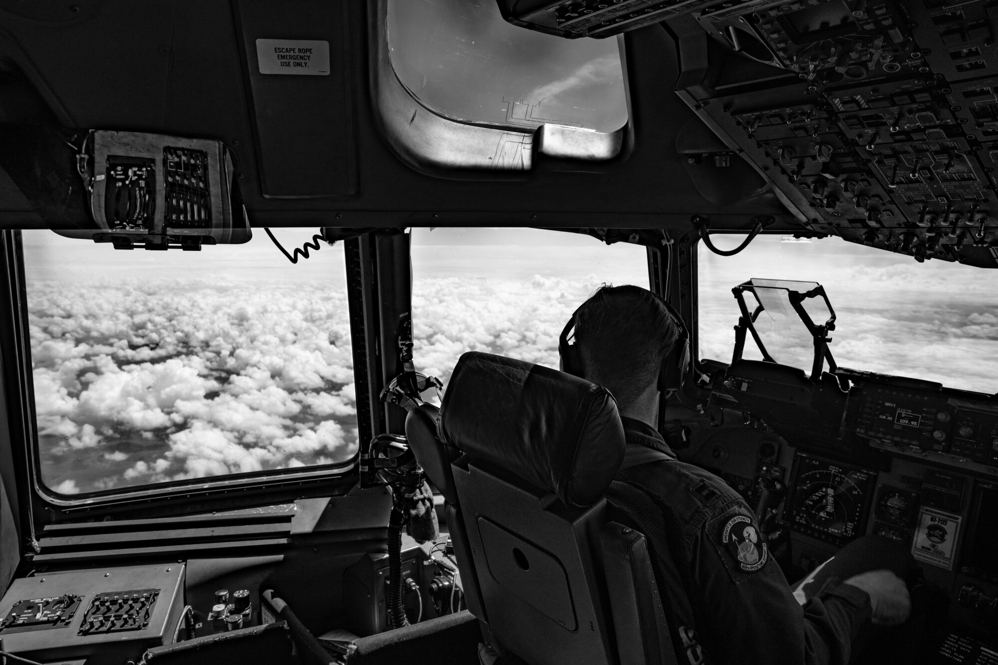 U.S. Air Force Capt. Dustin Weisner, 3rd Airlift Squadron pilot, looks out the window of a C-17 Globemaster III during a Leadership Central Delaware orientation flight near the U.S. East Coast, May 15, 2025. The LCD program, operated by the Central Delaware Chamber of Commerce, visits Dover AFB annually to gain better understanding of base operations and to build community ties with the Air Force. (U.S. Air Force photo by Staff Sgt. Marco A. Gomez)