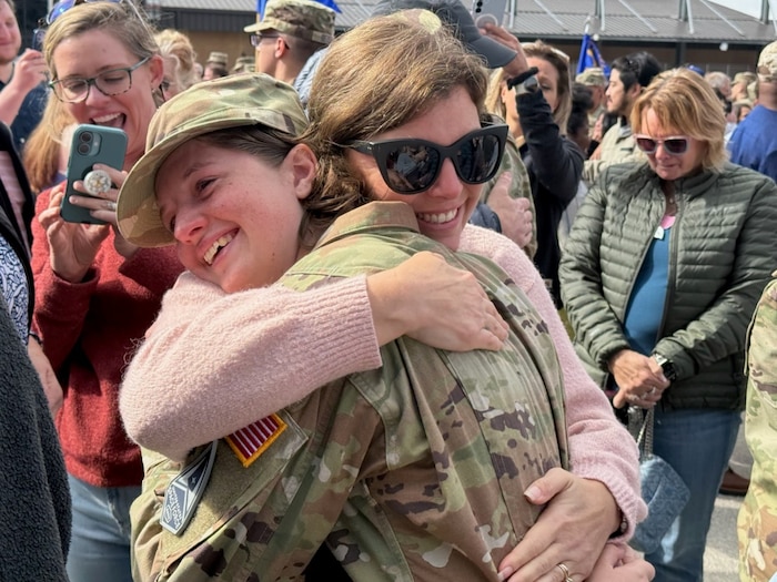 Space Force Specialist hugs mother at coining
