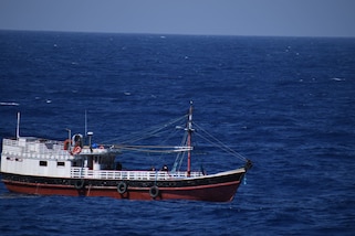 Law enforcement crew members aboard U.S. Coast Guard Cutter Calhoun (WMSL 759) conduct a boarding on a fishing vessel suspected of drug smuggling approximately 1,200 miles west of Las Palmas, Canary Islands, April 12, 2025. Calhoun’s crew offloaded approximately 19,055 pounds of cocaine and marijuana, worth an estimated $140.9 million, at Port Everglades, May 16, 2025. (U.S. Coast Guard photo)