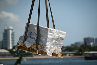 Bales of illegal narcotics are offloaded by crew members of U.S. Coast Guard Cutter Calhoun (WMSL 759) in Port Everglades, May 16, 2025. Calhoun’s crew offloaded more than 19,055 pounds of cocaine and marijuana valued at approximately $140.9 million in Port Everglades, May 16, 2025. (Coast Guard photo by Petty Officer 3rd Class Jessica Walker)