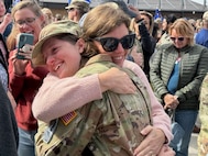 Space Force Specialist hugs mother at coining