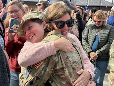 Space Force Specialist hugs mother at coining