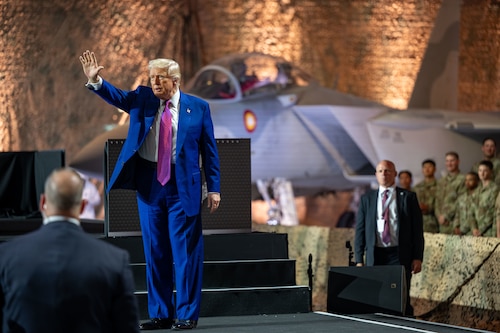 President Donald J. Trump waves to the crowd at the end of his address during a visit at Al Udeid Air Base, Qatar, May 15, 2025. Trump visited with troops during his trip to the Middle East, which included stops in Saudi Arabia, Qatar and the United Arab Emirates. (U.S. Air Force photo by Senior Airman Amanda Jett)
