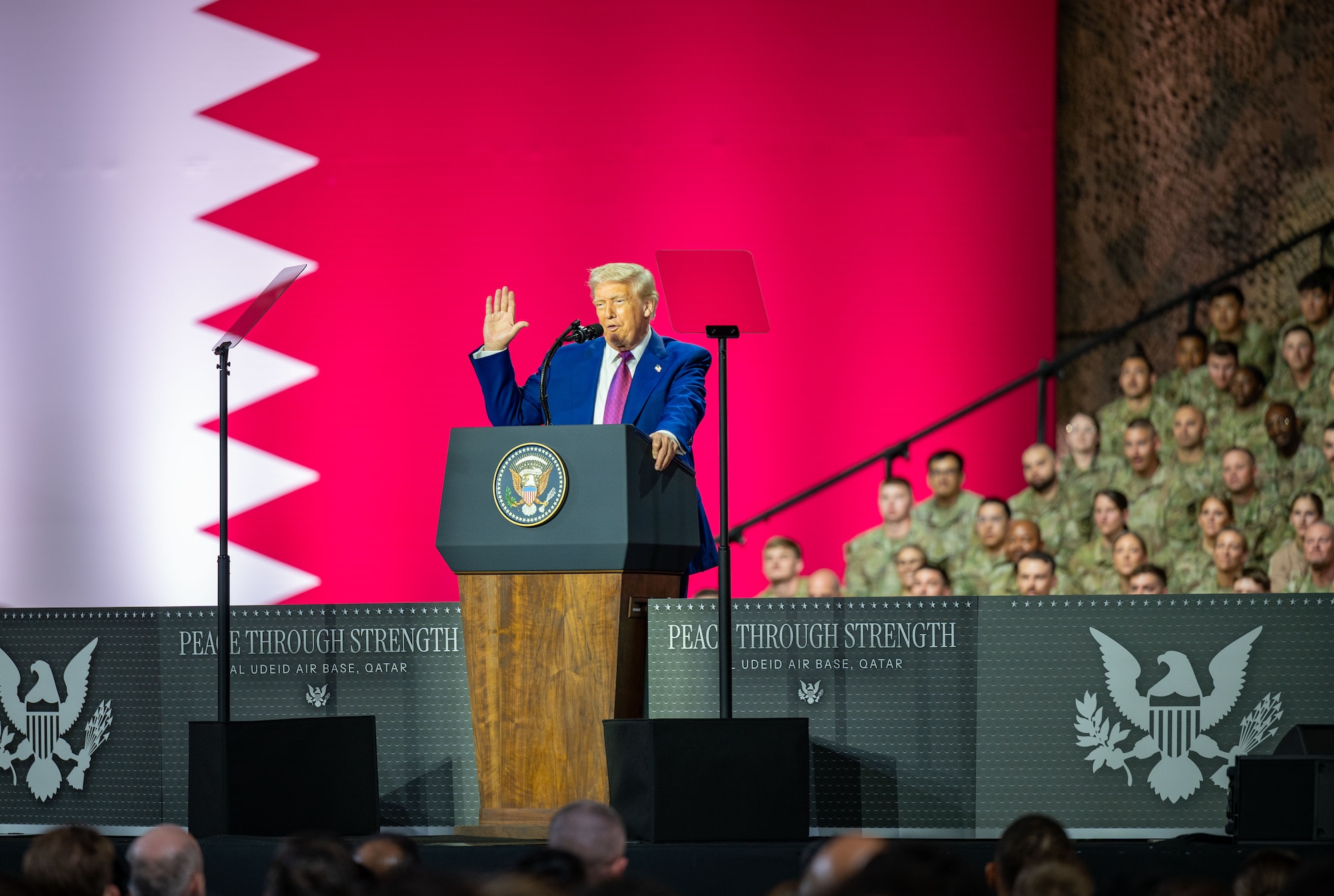 President Donald J. Trump waves to U.S. service members, Qatari armed forces and coalition partners during a troop engagement at Al Udeid Air Base, Qatar, May 15, 2025. Over 2,000 U.S. service members gathered to hear U.S. President Donald J. Trump’s address which outlined his administration’s defense priorities. (U.S. Air Force photo by Senior Airman Amanda Jett)