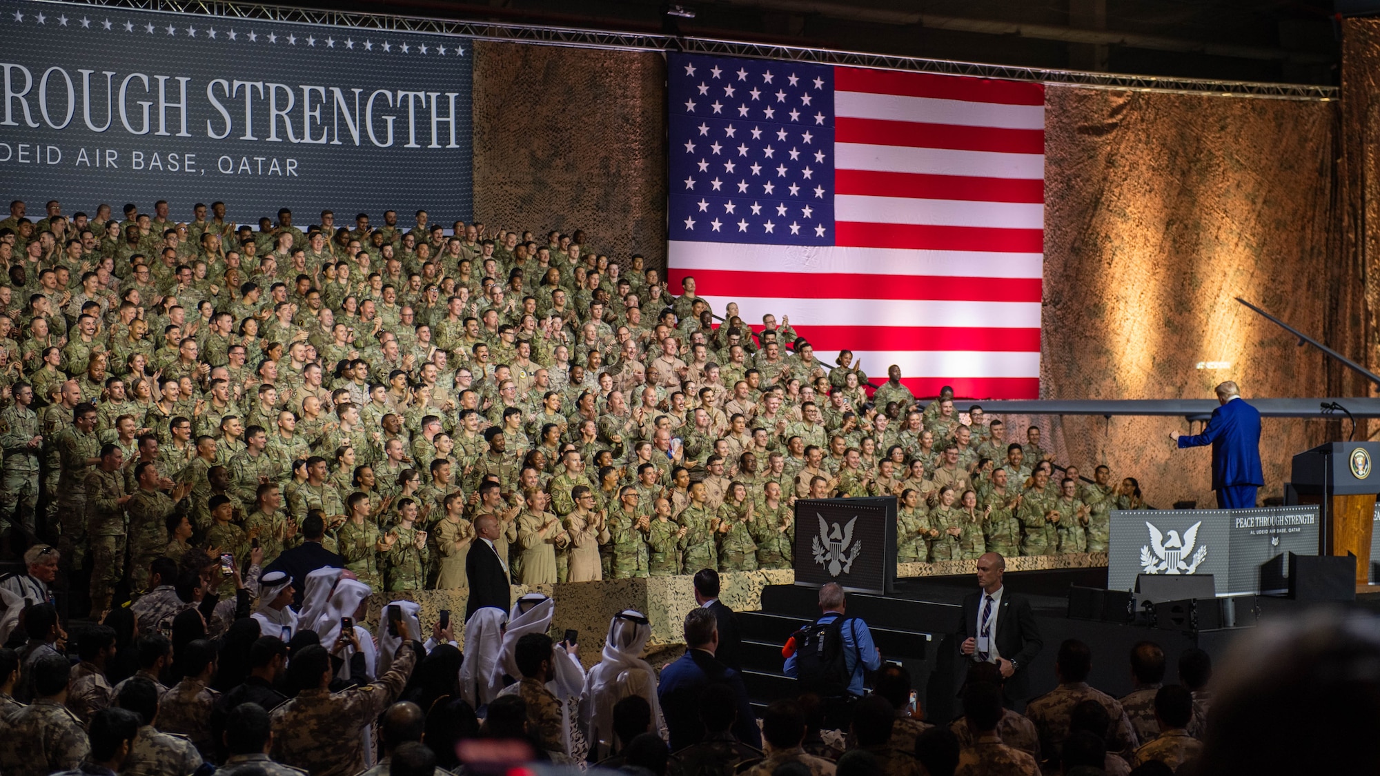 President Donald J. Trump waves to the crowd at the end of his address during a visit within the U.S. Central Command area of responsibility, May 15, 2025. Trump visited with troops during his trip to the Middle East, which included stops in Saudi Arabia, Qatar and the United Arab Emirates. (U.S. Air Force photo by Master Sgt. J.D. Strong II)