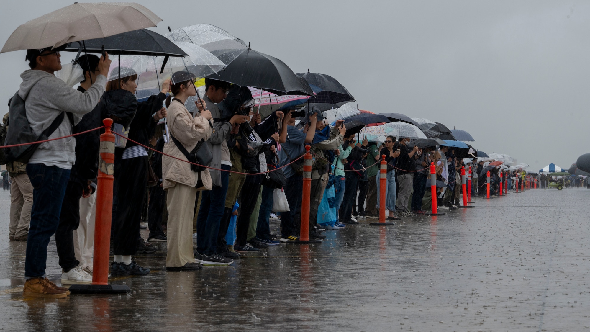 Attendees watch a CAPEX exercise from the UH-1N Huey.