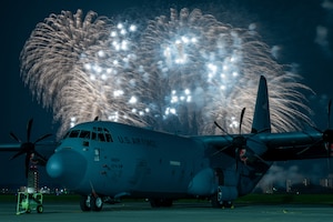 A U.S. Air Force C-130J Super Hercules assigned to the 36th Airlift Squadron sits on the flight line during the fireworks display of Japanese-American Friendship Festival 2025 at Yokota Air Base, Japan.