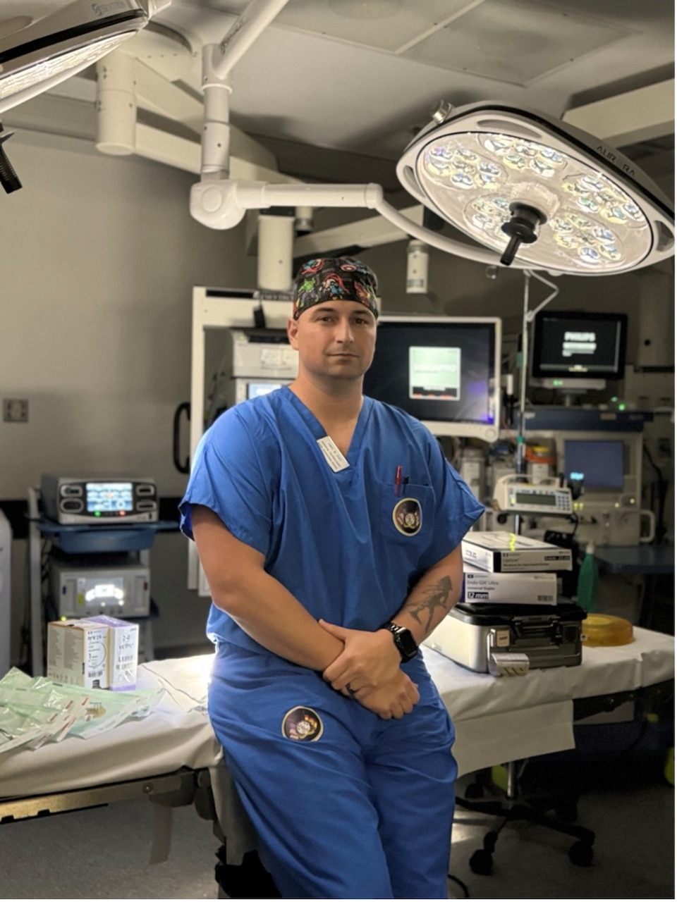 250416-N-FT324-6839. Hospital Corpsman 1st Class Brandon Day, a surgical technologist assigned to the Directorate for Surgical Services at NMRTC Rota, stands in the operating room where he supports surgical readiness and patient care operations. (U.S. Navy Photo by Lt. Cmdr. Alicia Sacks)