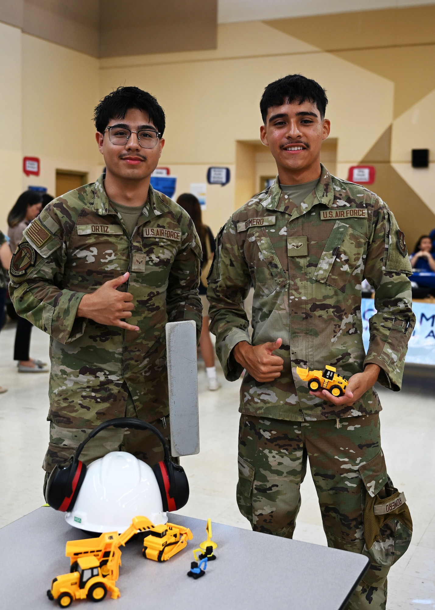 Airmen volunteer during Career Day at Okkodo High School, Guam, May 16, 2025. The Airmen discussed career pipelines and day to day life on the job. (U.S. Air Force photo by Senior Airman Audree Campbell)