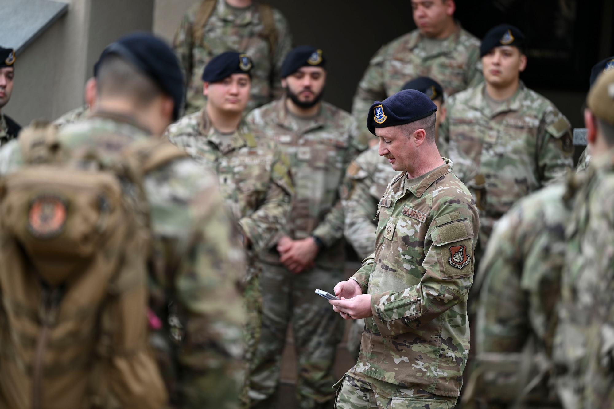 Master Sgt. Christopher Pate, 8th Security Forces Squadron defender, lists the names of defenders who perished during combat during the Police Week opening ceremony at Kunsan Air Base, Republic of Korea, May 16, 2025. After the ceremony, defenders participated in various events such as a ruck, and a “Battle of the Pack” competition.