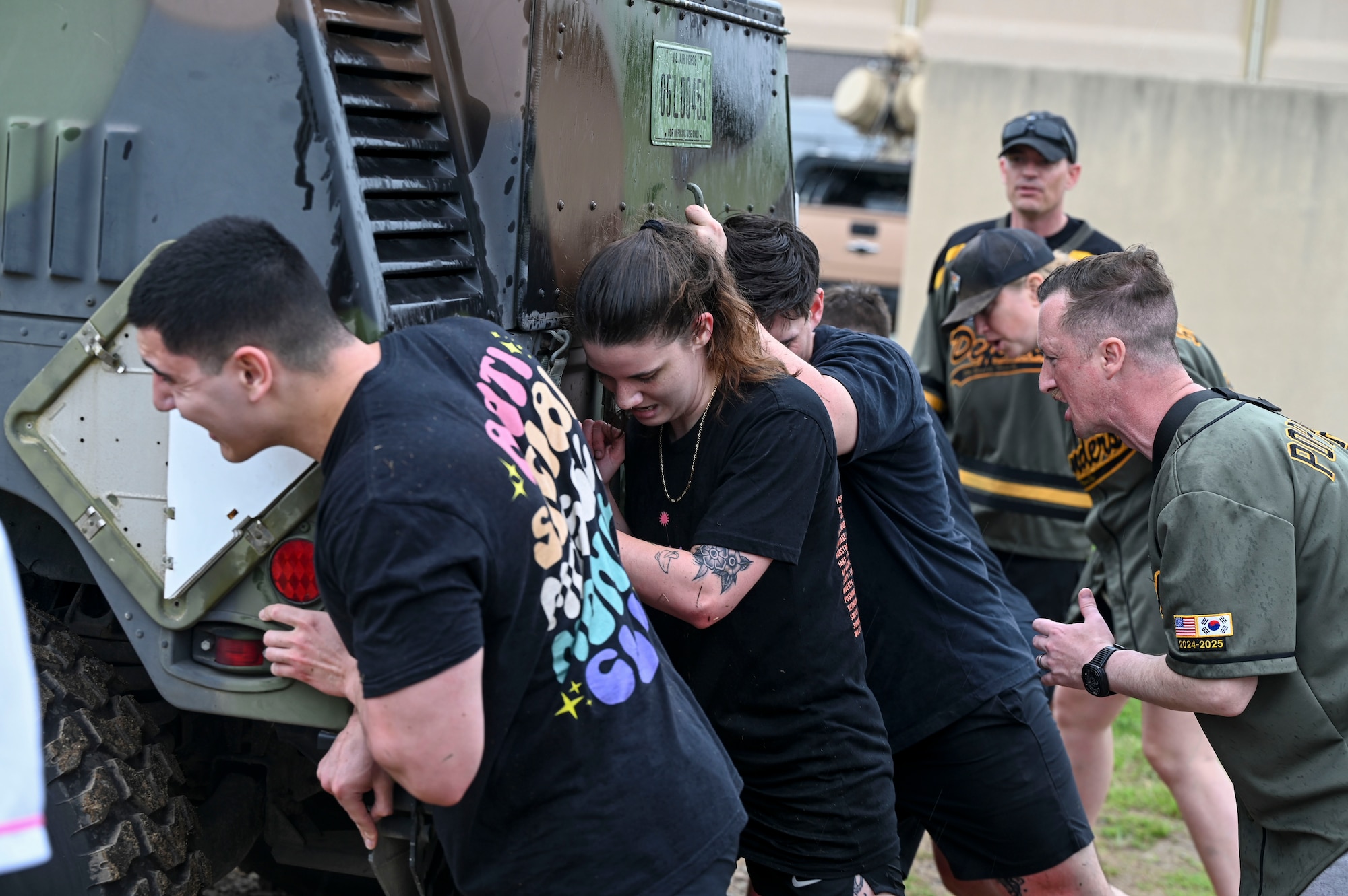 Airmen assigned to the 8th Fighter Wing, push a Humvee during the Police Week “Battle of the Pack” competition at Kunsan Air Base, Republic of Korea, May 16, 2025. Police Week honors and commemorates the lives of those lost in the line of duty.