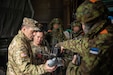 U.S. Army Gen. Christopher Donahue, the commanding general of U.S. Army Europe and Africa (USAREUR-AF), holds an Estonian soldier's drone during Exercise Hedgehog 25 near Camp Reedo, Estonia, May 15, 2025. Exercise Hedgehog 25 is a large-scale international military exercise led by the Estonian Defence Forces, focused on the rapid deployment of allied forces and the enhancement of multinational interoperability. (U.S. Army photo by Pfc. Jaidyn Moore)
