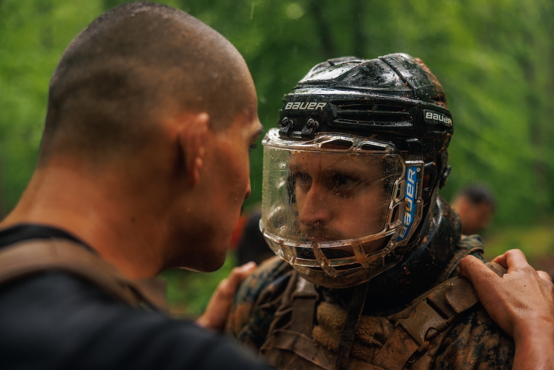 U.S. Marine Corps Sgt. Daniel Morales, a martial arts instructor trainer, left, provides constructive feedback to Sgt. Zachary Cirac, a student with the Martial Arts Instructor Trainer Course 2-25, before an engagement during the “Fighting Holes” training event at The Basic School on Marine Corps Base Quantico, May 13, 2025. Squads engaged head-to-head inside of fighting holes simulating close quarter combat while implementing techniques learned within the Marine Corps Martial Arts Program. (U.S. Marine Corps photo by Lance Cpl. Braydon Rogers)