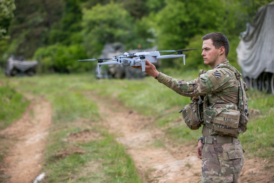 U.S. Army Spc. Anton Lane, a combat medic with specialized drone training, assigned to 5-7 Cavalry, 1st Armored Brigade Combat Team, 3rd Infantry Division prepares to deploy a Skydio X10E4TT drone by hand during exercise Combined Resolve 25-2 at Hohenfels, Germany on May 17, 2025.