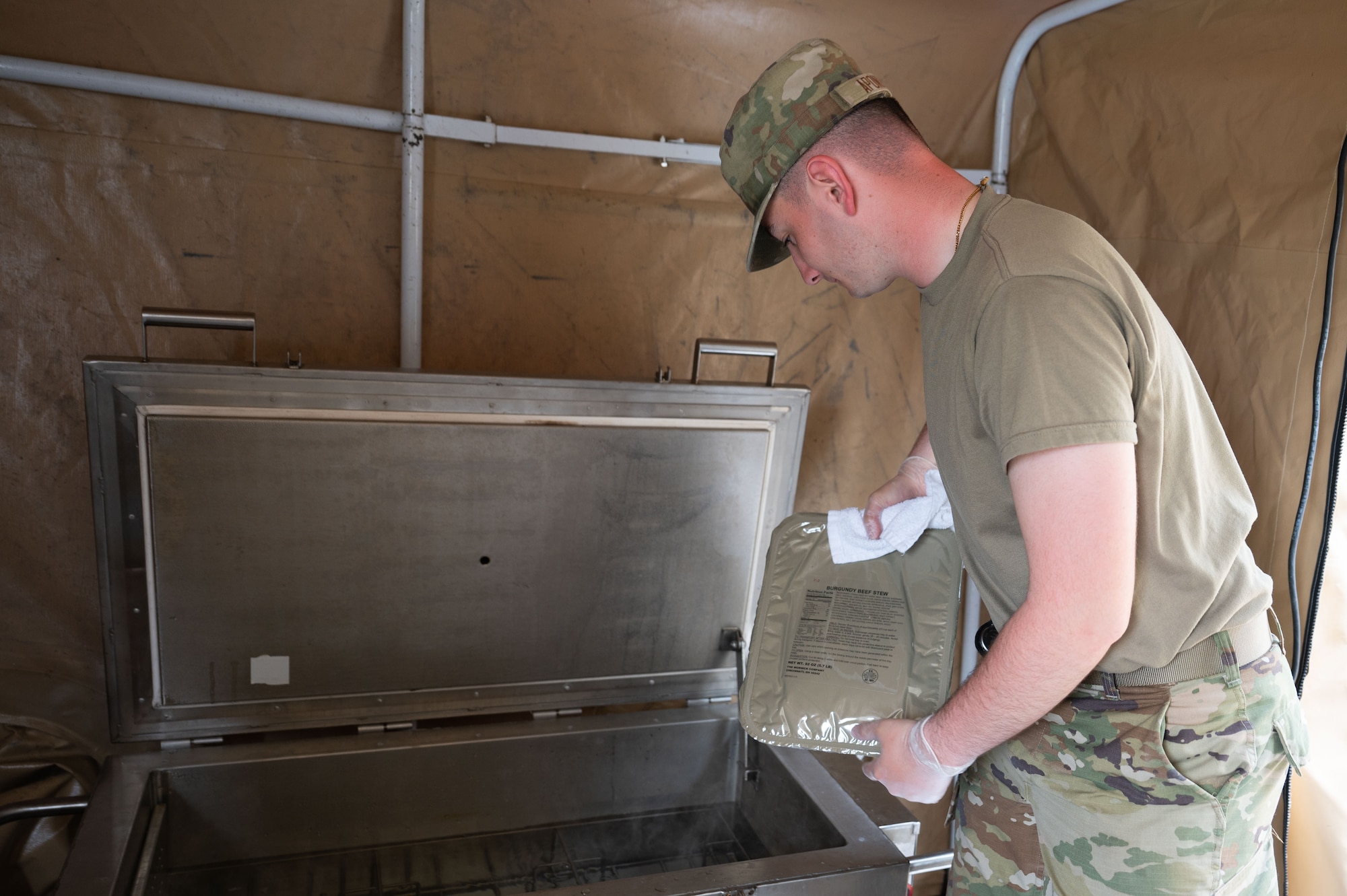 Airman places a UGR into a Babington burner.