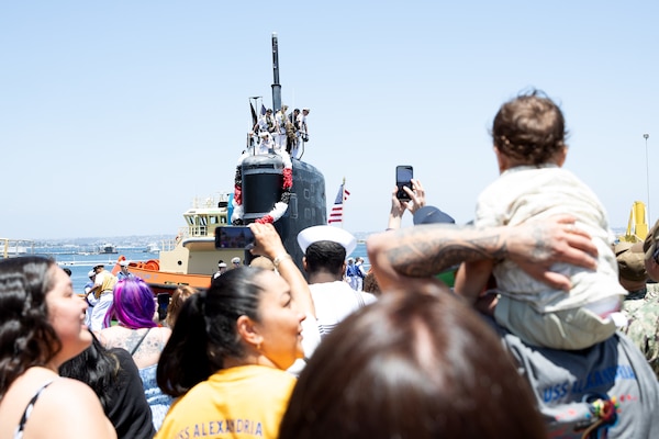 Family and friends watch as the Los Angeles-class fast-attack submarine USS Alexandria (SSN 757) returns to Naval Base Point Loma following a seven-month deployment to the U.S. Indo-Pacific Command area of responsibility, May 15, 2025.