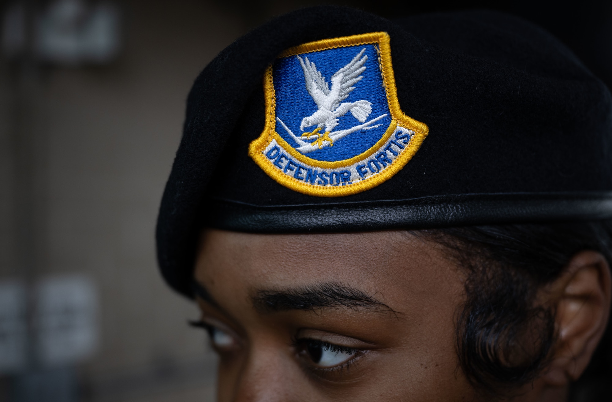 U.S. Airman 1st Class Lemaya Veale, 436th Security Forces Squadron response force member, displays her SF beret at Dover Air Force Base, Delaware, May 14, 2025. The motto “defensor fortis” means “strong defender,” the official motto of SF, defining the concept of strength in adversity, taught to members of SF. (U.S. Air Force photo by Airman 1st Class Liberty Matthews)