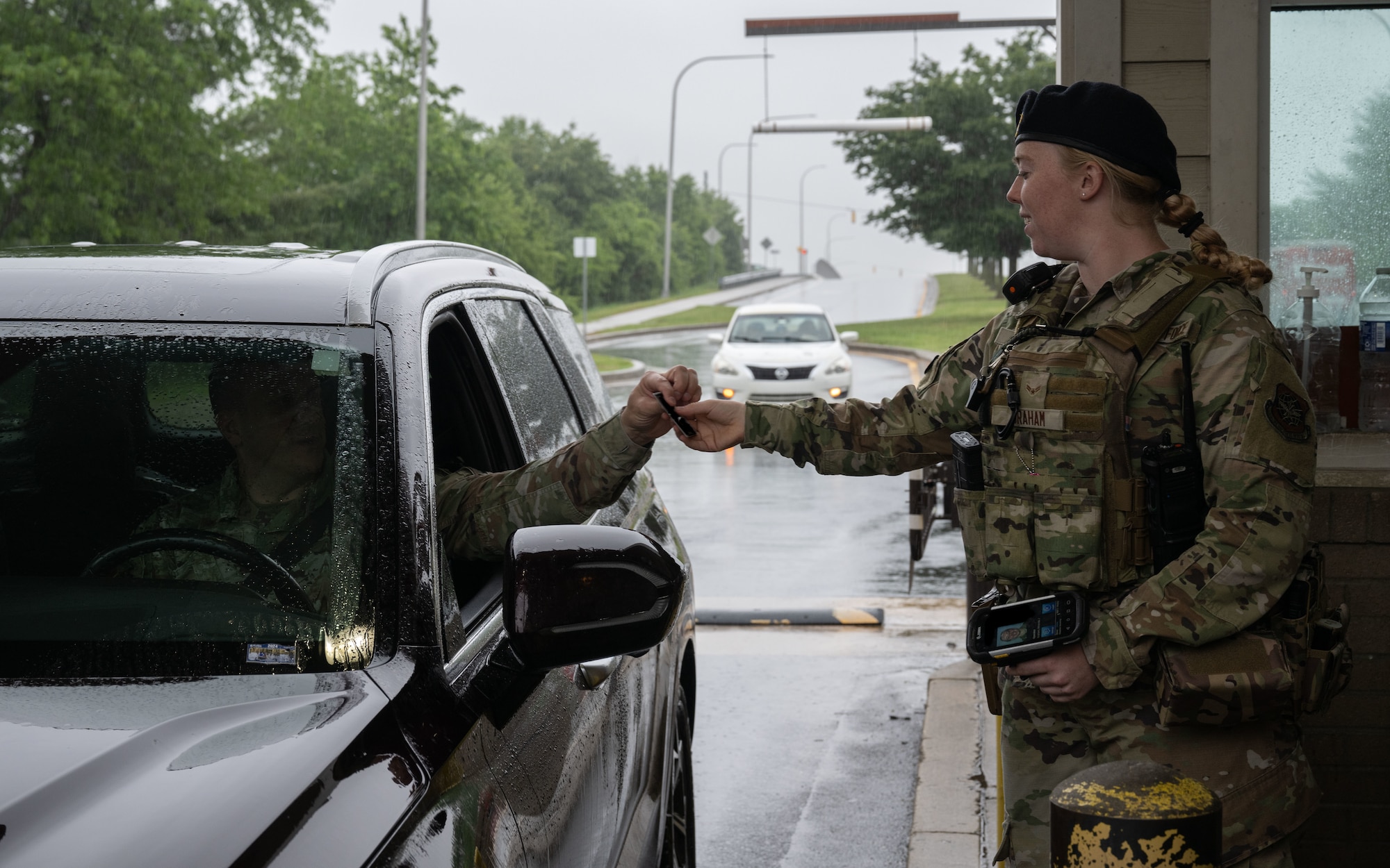 U.S. Airman 1st Class Miranda Graham, 436th Security Forces Squadron response force member, checks common access cards at Dover Air Force Base, Delaware, May 14, 2025. The motto “defensor fortis” means “strong defender,” the official motto of SF, defining the concept of strength in adversity, taught to members of SF. (U.S. Air Force photo by Airman 1st Class Liberty Matthews)