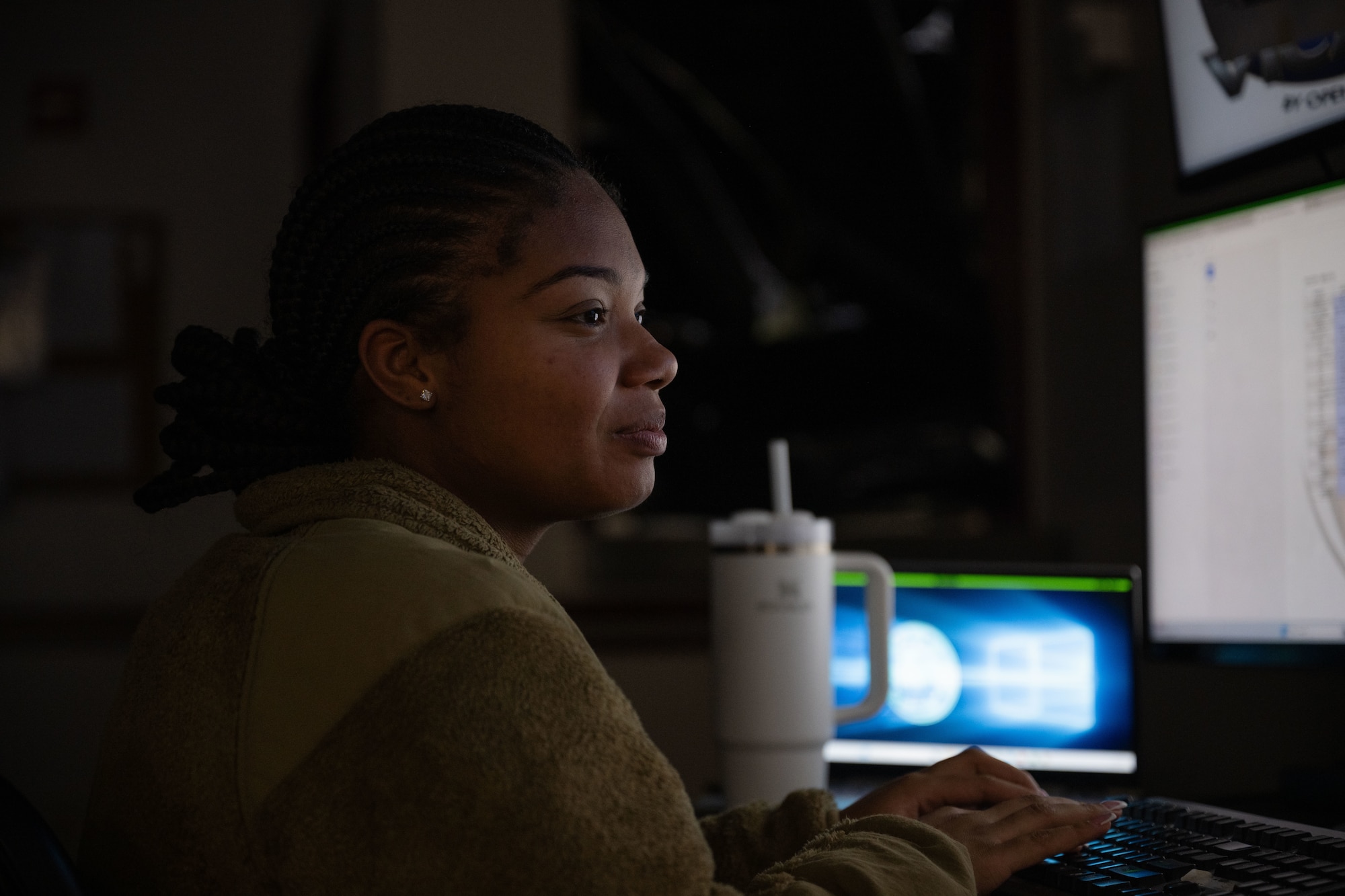 U.S. Airman 1st Class Alyssa Richardson, 436th Security Forces Squadron alarm monitor, checks alerts on her computer at Dover Air Force Base, Delaware, May 14, 2025. The motto “defensor fortis” means “strong defender,” the official motto of SF, defining the concept of strength in adversity, taught to members of SF. (U.S. Air Force photo by Airman 1st Class Liberty Matthews)