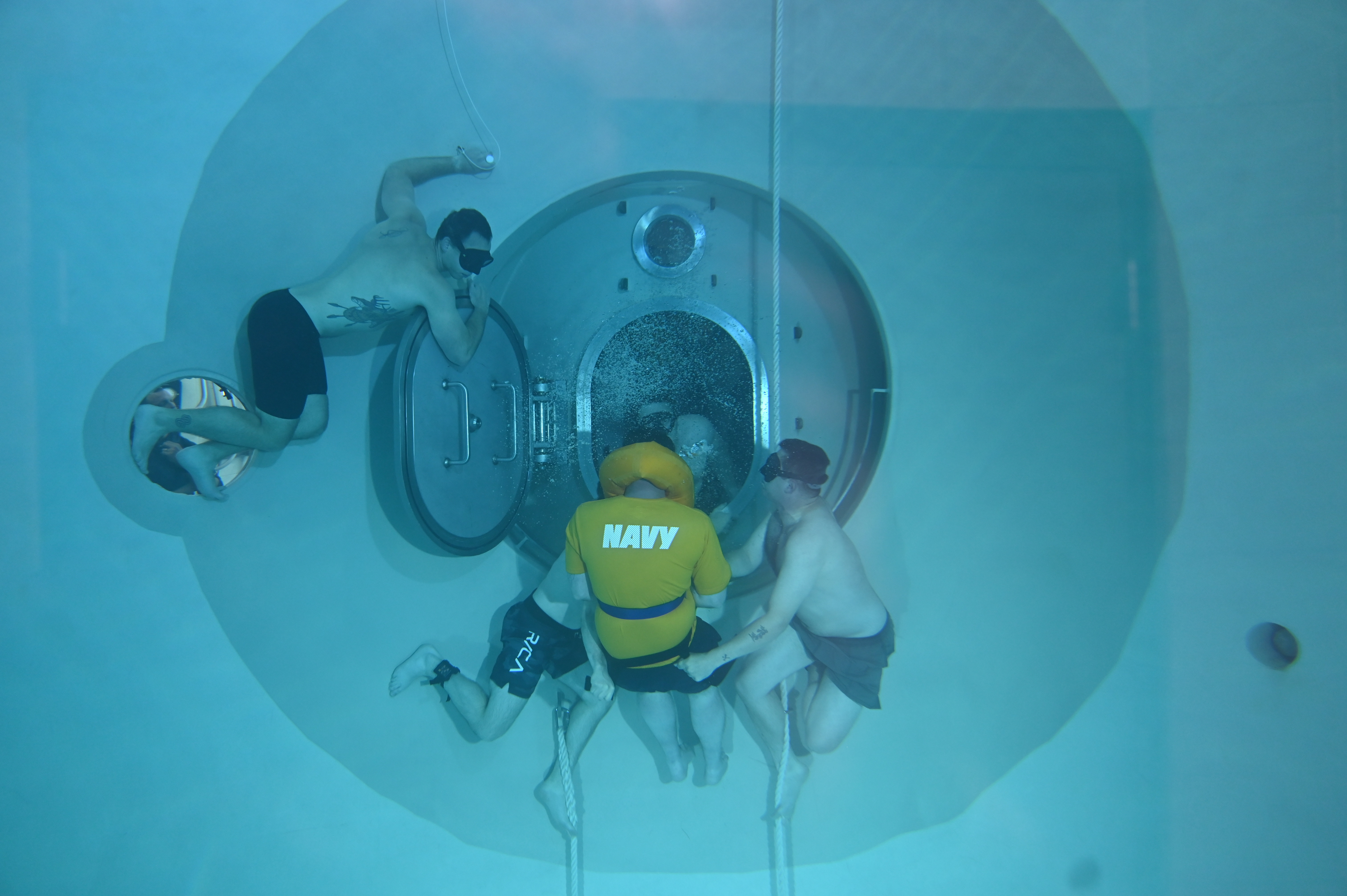 U.S. Naval Submarine Schools students conduct training in the school’s Pressurized Submarine Escape Trainer as part of their curriculum, May 13, 2025. 

The PSET teaches submarine sailors how to escape from a submarine that is unable to surface and then survive on the water’s surface until help arrives. 

U.S. Navy photos by SN Duncan Woodard