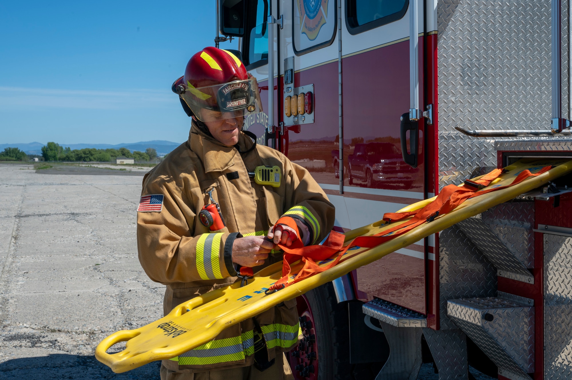 Fairchild AFB firefighters respond to a simulated emergency