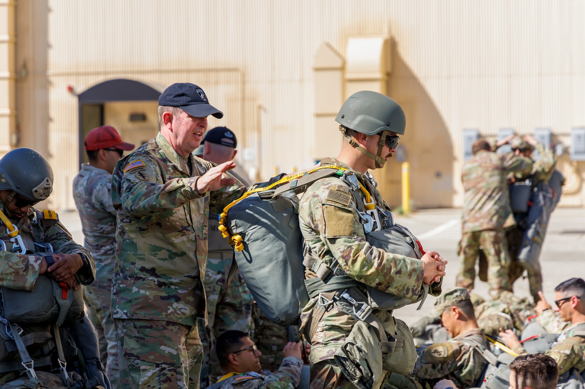 Brig. Gen. James Sanders, U.S. Army Civil Affairs and Psychological Operations Command (Airborne) Deputy Commanding General, inspects Soldier’s equipment prior to conducting a static line jump as part of a joint training exercise on Edwards Air Force Base, California, April 11. (Air Force photo by CJ Raterman)