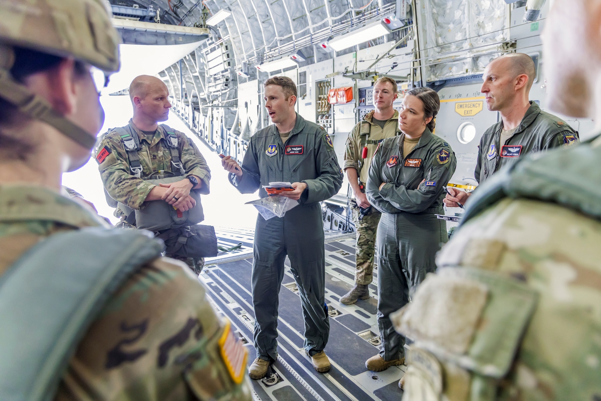 Maj. Jeremy Rohn, 418th Flight Test Squadron C-17 test pilot, provides final briefs to Army Civil Affairs Soldiers during a joint training exercise at Edwards Air Force Base, California, April 11. (Air Force photo by James West)