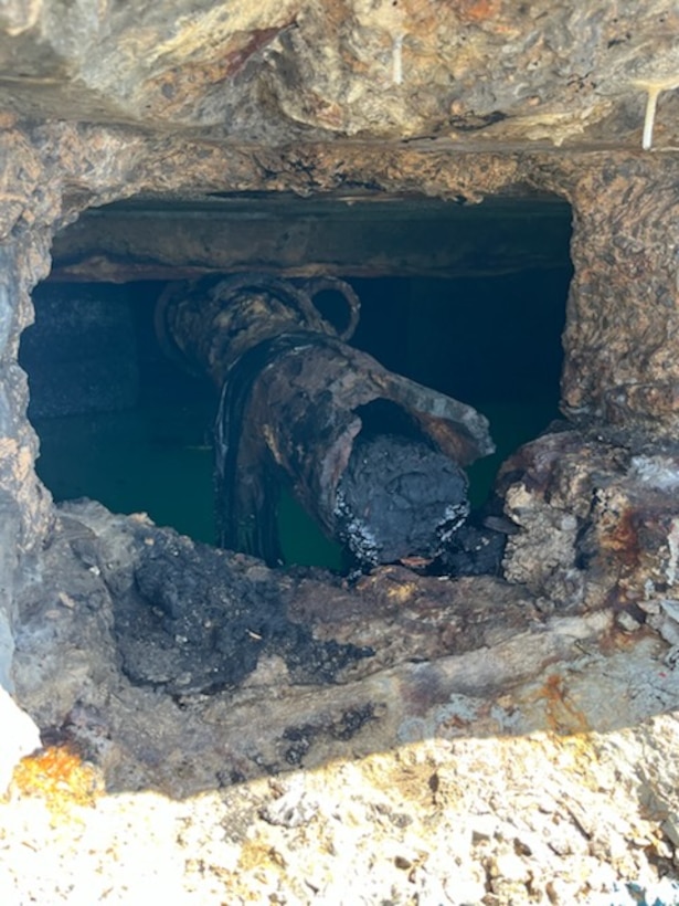 Photo of legacy pipe discharging oil between Piers 2 and 3 in San Juan Harbor, Puerto Rico. Since April 11, 2025, Coast Guard Sector San Juan’s Incident Management team is investigating, responding and working with contracted oil spill removal organizations and local government authorities to contain and mitigate the pollution threat and clean up any recoverable product.  (U.S. Coast Guard photo)