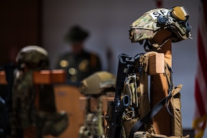 Battlefield crosses are displayed during a Final Guard Mount ceremony at Davis-Monthan Air Force Base, Arizona, May 16, 2025. The battlefield cross is a memorial which commemorates fallen troops, featuring a rifle, helmet and empty pair of boots. (U.S. Air Force photo by Senior Airman Jasmyne Bridgers-Matos)
