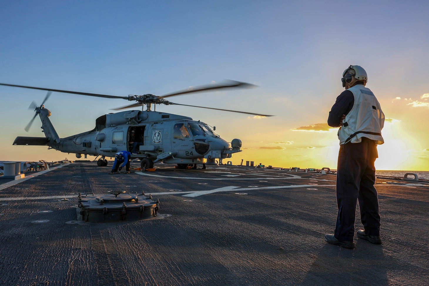 241021-N-XO016-5923 MEDITERRANEAN SEA (Oct. 21, 2024) Sailors assigned to the guided-missile destroyer USS Arleigh Burke (DDG 51) chock and chain a MH-60R from Helicopter Maritime Squadron 79 during flight operations, Oct. 21, 2024. Arleigh Burke is on a scheduled deployment in the U.S. 6th Fleet area of operations supporting U.S. Naval Forces Europe-Africa to defend U.S., allied and partner interests. (U.S. Navy photo by Mass Communication Specialist 1st Class Zac Shea)