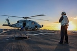 241021-N-XO016-5923 MEDITERRANEAN SEA (Oct. 21, 2024) Sailors assigned to the guided-missile destroyer USS Arleigh Burke (DDG 51) chock and chain a MH-60R from Helicopter Maritime Squadron 79 during flight operations, Oct. 21, 2024. Arleigh Burke is on a scheduled deployment in the U.S. 6th Fleet area of operations supporting U.S. Naval Forces Europe-Africa to defend U.S., allied and partner interests. (U.S. Navy photo by Mass Communication Specialist 1st Class Zac Shea)