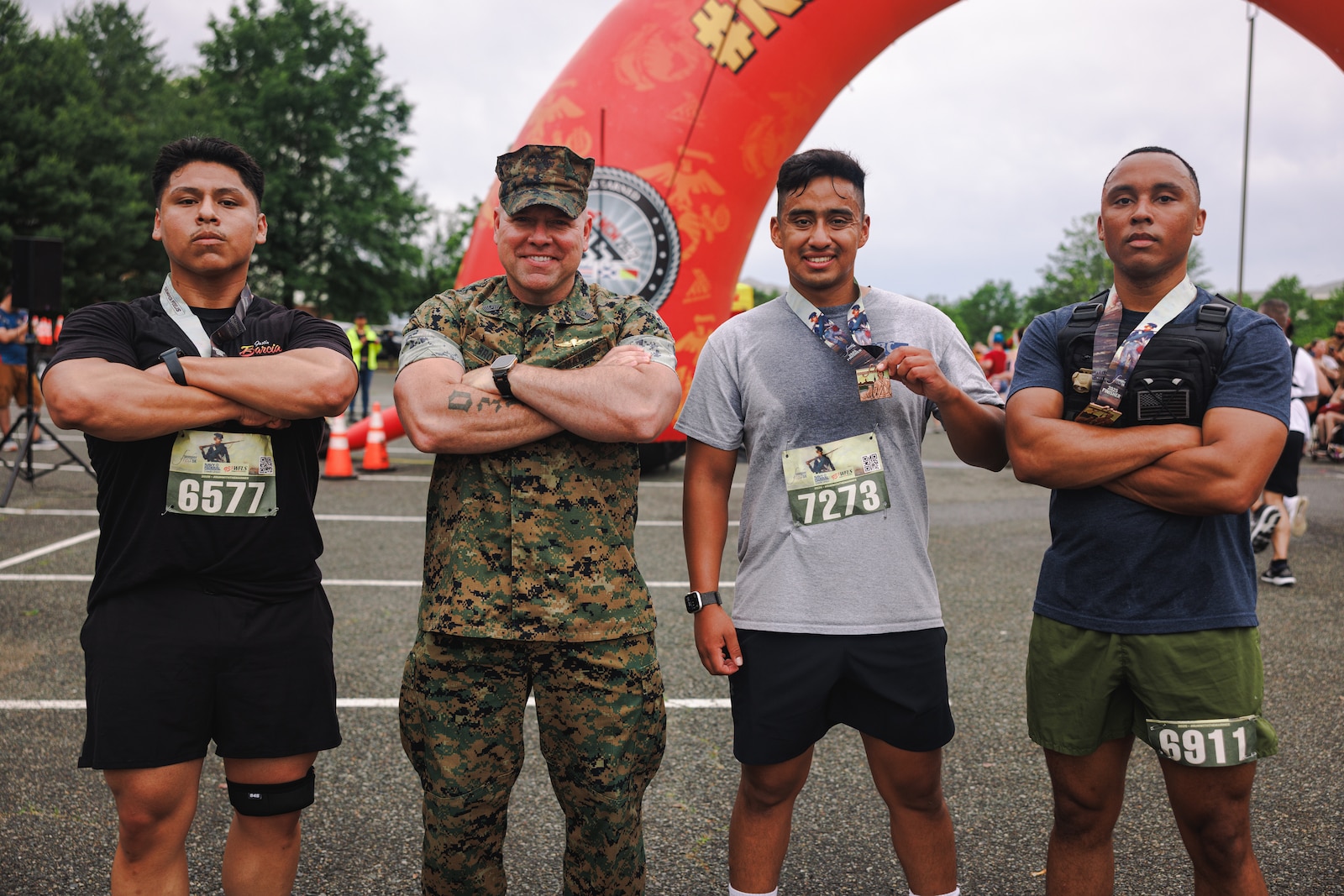 U.S. Marine Corps Sgt. Maj. Michael Brown, sergeant major of Marine Corps Base Quantico, poses for a photo with participants at the 2025 Semper Fred 5K race in Fredericksburg, Virginia, May 17, 2025. The Semper Fred 5k is a family-friendly, all ages event in historic Fredericksburg, the day before the Marine Corps Historic Half. (U.S. Marine Corps photo by Lance Cpl. Braydon Rogers)