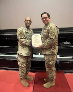 Special Agent Rogelio Ruiz receive the Air and Space Force Commendation medal from Col. Lee Ballard Jr., AFOSI 4 FIR commander, following his life saving actions, April 25, 2025.