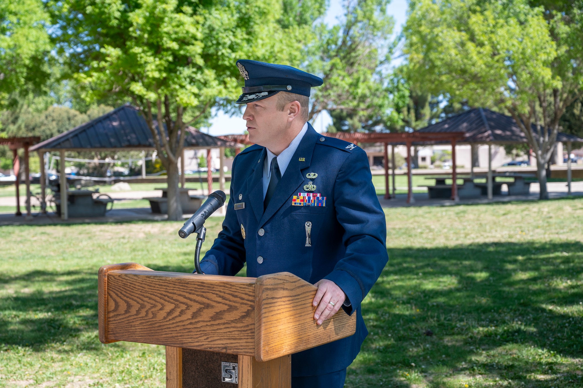 U.S. Air Force Col. Michael Power, 377th Air Base Wing and Installation commander, delivers opening remarks during the Marquez Park plaque rededication ceremony at Kirtland Air Force Base, New Mexico, May 16, 2025. The plaque was rededicated during a ceremony recognizing Marquez's legacy as a transformative leader in Air Force logistics and maintenance. (U.S. Air Force photo by Senior Airman Jennifer Knope)