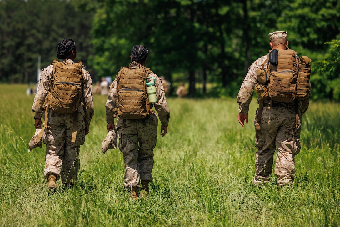 U.S. Marines with Marine Corps Air Facility Quantico walk to an exfiltration site at The Basic School on Marine Corps Base Quantico, May 15, 2025. Marines with MCAF embarked on a two-day field exercise including events such as land navigation, a mess night, a machine-gun range and culminating with a field exfiltration. (U.S. Marine Corps photo by Lance Cpl. Braydon Rogers)