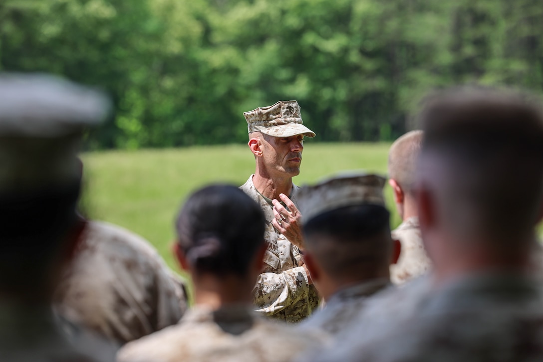U.S. Marine Corps Col. Scott W. Warman, commanding officer of Marine Corps Air Facility Quantico addresses the Marines during a field exercise at The Basic School on Marine Corps Base Quantico, Virginia, May 15, 2025. Marines with MCAF embarked on a two-day field exercise including events like land navigation, a mess night, a machine gun range and culminating with a field exfiltration. (U.S. Marine Corps photo by Lance Cpl. Donovan E. Melendez)