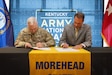 U.S. Army Maj. Gen. Haldane Lamberton (left), Kentucky’s adjutant general, and Dr. Jay Morgan, president of Morehead State University (MSU) signs the memorandum of understanding (MOU) between MSU and KYNG at MSU in Morehead, Ky. on May 5, 2025. KYNG and MSU signed the MOU to give more educational benefits to Soldiers and Airmen of the KYNG. (U.S. Army National Guard photo by Andy Dickson)