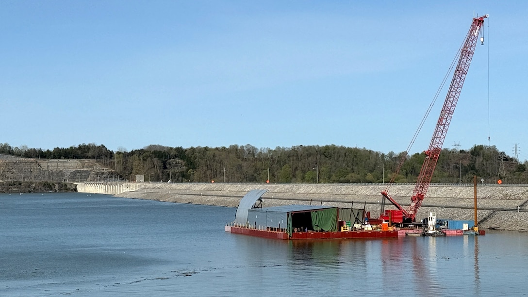 The U.S. Army Corps of Engineers Nashville District and contractor American Bridge Company prepares a spillway gate on a work barge for future installation at Wolf Creek Dam April 9, 2025, at Lake Cumberland in Jamestown, Kentucky. (USACE Photo by Leon Roberts)