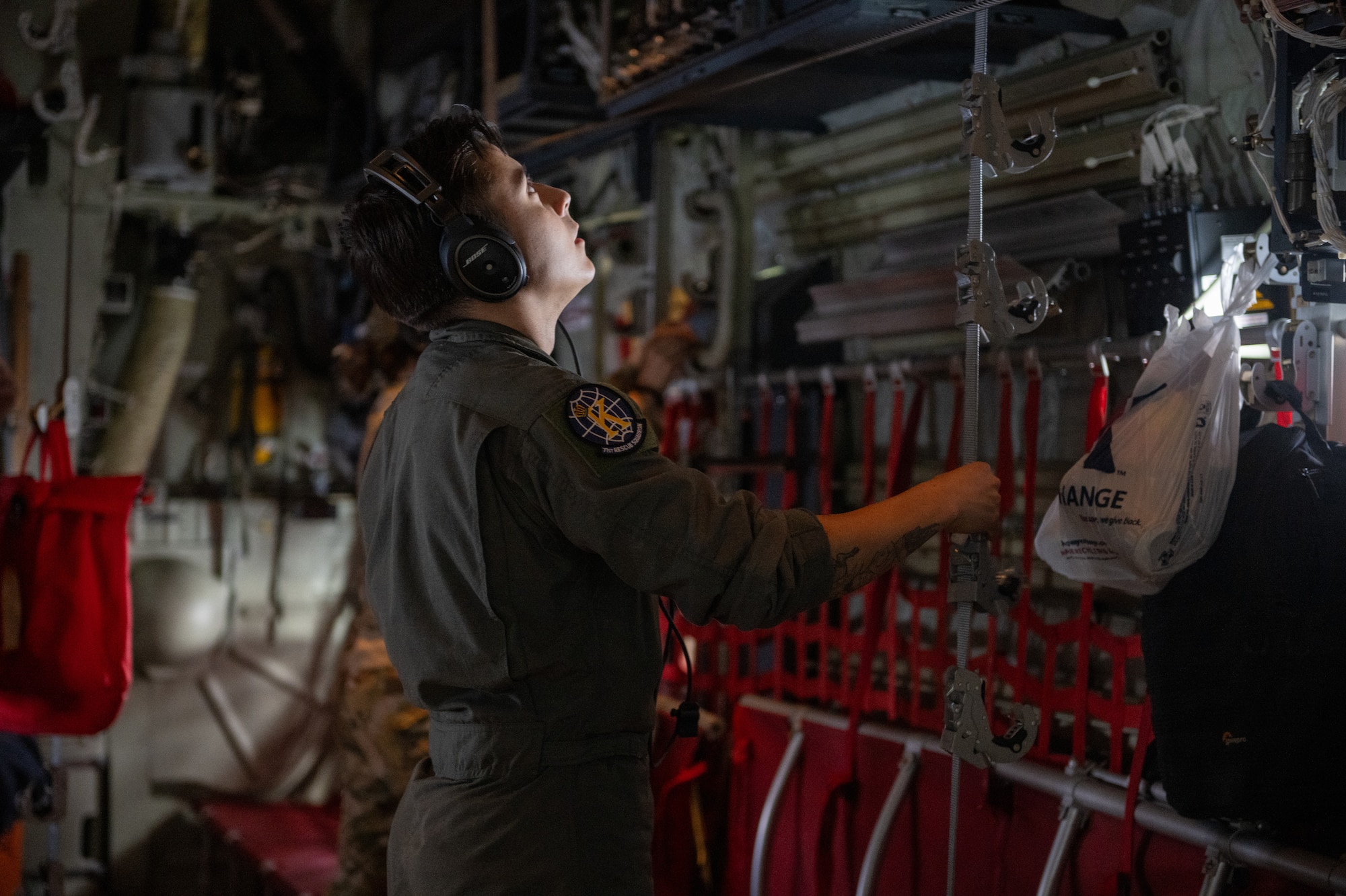Senior Airman Gabriel Romero, 71st Rescue Squadron HC-130J Combat King II loadmaster, prepares the aircraft for aero-medical evacuation crew during a training exercise at Maxwell Air Force Base, Alabama, May 1, 2025. As combat search and rescue training exercises like this prove invaluable during any real world scenarios. (U.S. Air Force photo by Airman 1st Class Iain Stanley)