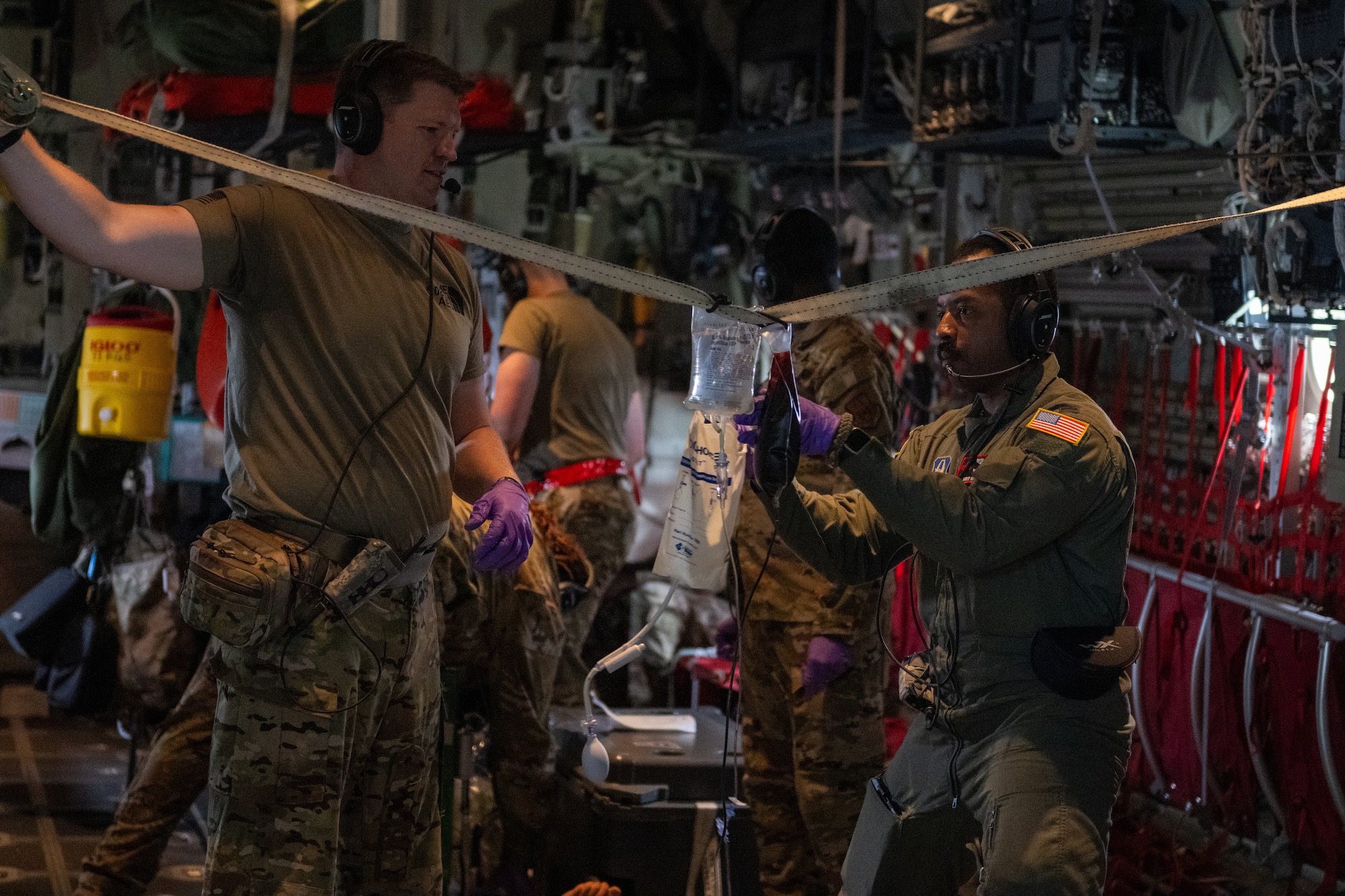 U.S. Air Force Airmen assigned to the 908th Aero-Medical Evacuation Squadron and 71st Rescue Squadron execute an aero-medical evacuation training at Maxwell Air Force Base, Alabama, May 1, 2025. The AE personnel had to receive the patients, triage and ascertain their injuries, and load them in under 15 minutes which was accomplished safely. (U.S. Air Force photo by Airman 1st Class Iain Stanley)