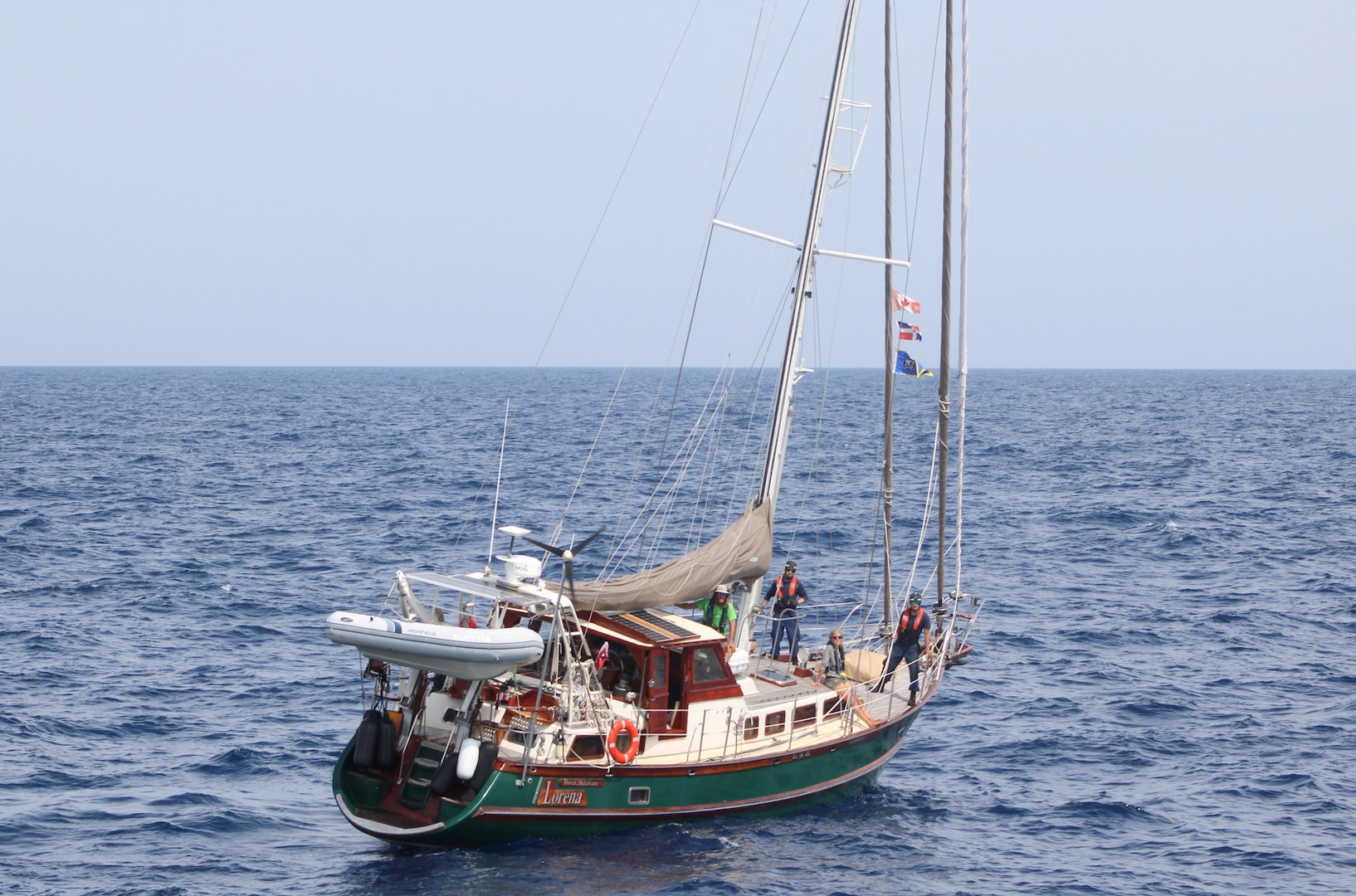 The crew of Coast Guard Cutter Forward (WMEC 911) rescued two people and their disabled 60-foot sailboat nearly 90 miles offshore Charleston, South Carolina, May 17, 2025. Forward's crew towed the sailboat to coastal waters, where a Coast Guard Station Charleston boat crew and a commercial salvage vessel took over and safely transported the two sailors and their boat to shore. (U.S. Coast Guard photo by Petty Officer 2nd Class Alexander Mclemore)