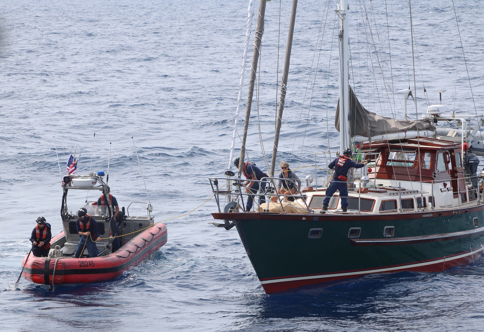 The crew of Coast Guard Cutter Forward (WMEC 911) rescued two people and their disabled 60-foot sailboat nearly 90 miles offshore Charleston, South Carolina, May 17, 2025. Forward's crew towed the sailboat to coastal waters, where a Coast Guard Station Charleston boat crew and a commercial salvage vessel took over and safely transported the two sailors and their boat to shore. (U.S. Coast Guard photo by Petty Officer 2nd Class Alexander Mclemore)