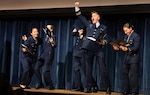 Cadets react to learning where they’ll be stationed after graduation at the 2025 Billet Night held March 6 at Coast Guard Academy (CGA) in New London, CT. For the first time this year, a matching algorithm was used to make assignments.