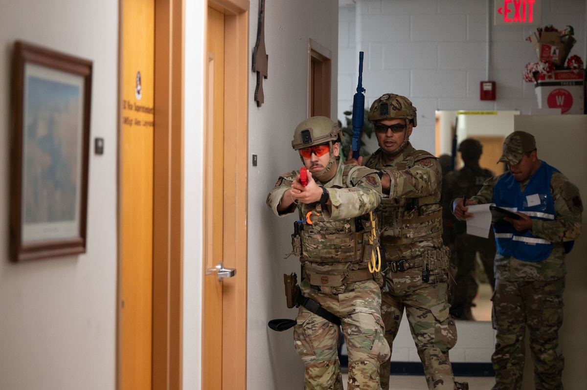 U.S. Air National Guard Security Forces Defenders assigned to the 162nd Wing clear a building during a simulated  Active Shooter exercise. Defenders at the 162nd Wing practice real-world scenarios to ensure the safety of people and property on the installation. (U.S. Air National Guard photo by Staff Sgt. Guadalupe Beltran)