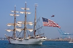 CGC Eagle parades into Los Angeles Harbor under the watchful eye of a CG Dolphin helicopter and 41-foot Utility Boat. (Photo by Michael Brodey, USCG Aux.)