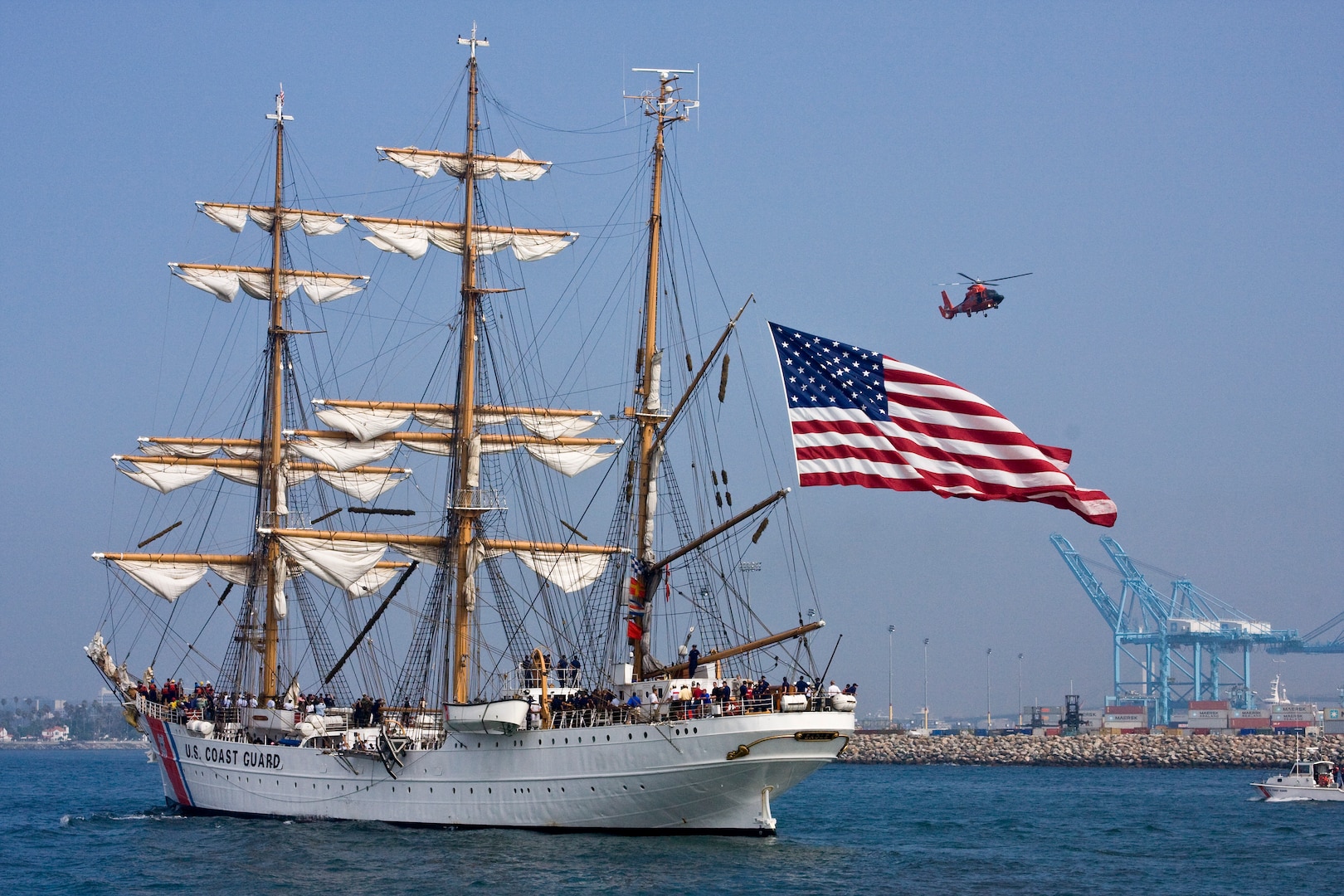 CGC Eagle parades into Los Angeles Harbor under the watchful eye of a CG Dolphin helicopter and 41-foot Utility Boat. (Photo by Michael Brodey, USCG Aux.)