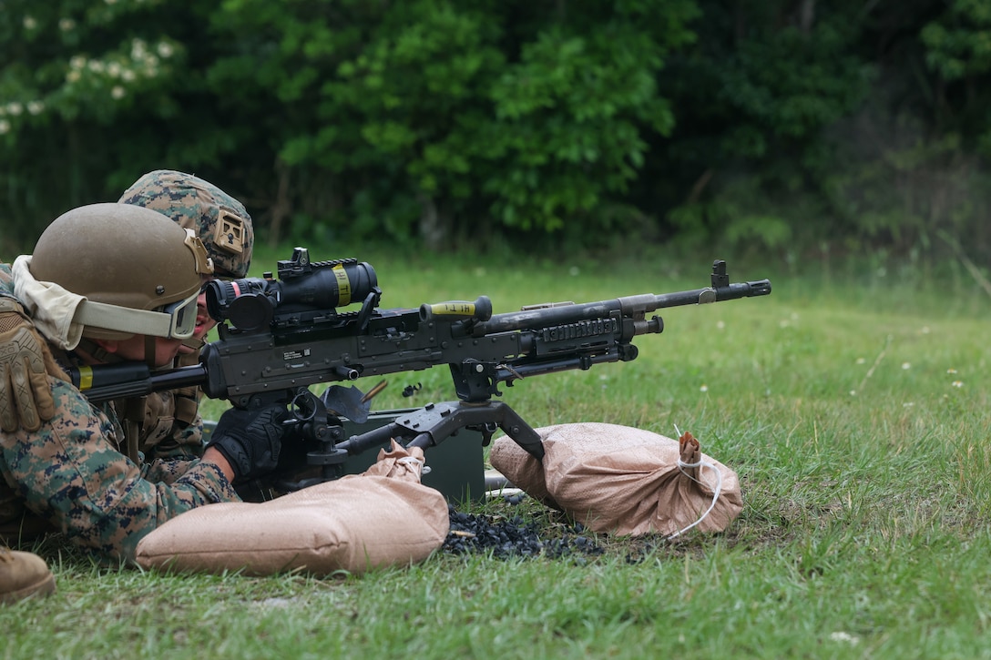 A U.S. Marine with Marine Air Support Squadron 2, Marine Air Control Group 18, 1st Marine Aircraft Wing changes an M240B machine gun barrel in the Central Training Area, Okinawa, Japan, May 13, 2025.
