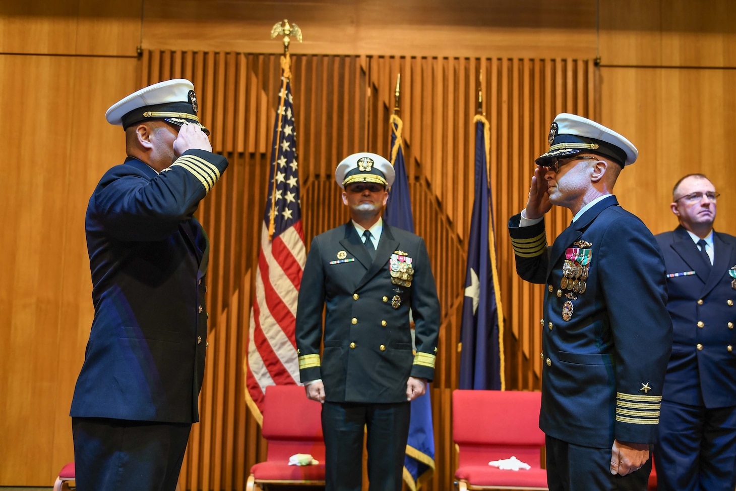 Capt. Nathan Luther relieves Capt. Chimi Zacot as commodore of Submarine Squadron 17 as Rear Adm. Christopher Nash, commander of Submarine Group (SUBGRU) 9, presides during a change of command ceremony held at the Naval Base Kitsap-Bangor chapel, May 16, 2025. SUBGRU-9 exercises administrative control authority for assigned submarine commands and units in the Pacific Northwest providing oversight for shipboard training, personnel, supply and material readiness of SSBNs and their crews. SUBGRU-9 is also responsible for nuclear submarines undergoing conversion or overhaul at Puget Sound Naval Shipyard in Bremerton. SUBGRU-9’s subordinate commands include Submarine Readiness Squadron 31, Submarine Squadrons 17 and 19, eight SSBNs, two SSGNs, and four SSNs homeported in the Pacific Northwest. (U.S. Navy photo by Mass Communication Specialist 2nd Class Gwedelyn Ohrazda)
