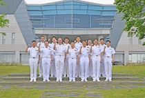 Rear Adm. Kang Dong-goo, commander, Republic of Korea (ROK) Navy Submarine Force, Rear Adm. Lincoln Reifsteck, commander, Submarine Group (CSG) 7, and their staff pose for a picture at Jeju Island, May 16, 2025, for the 60th Submarine Warfare Committee Meeting (SWCM).